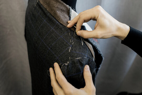 Closeup Of Tailor Fitting Bespoke Suit