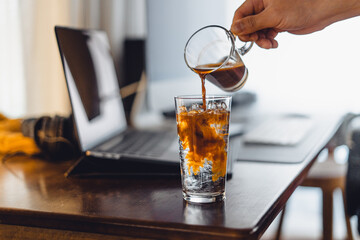 iced coffee on desk at home