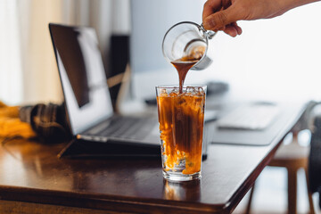 iced coffee on desk at home