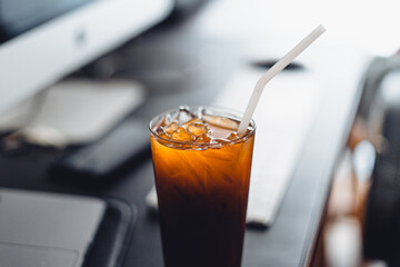 iced coffee on desk at home