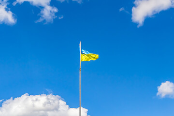 Photography on theme national Ukrainian flag in peaceful sky