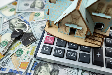 House keys  calculator and US dollar money. Real estate concept
