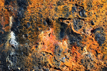 Rusty steel structure in sea water, closeup texture of rusted iron, vibrant colors of metal corrosion
