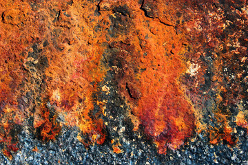 Rusty steel structure in sea water, closeup texture of rusted iron, vibrant colors of metal corrosion