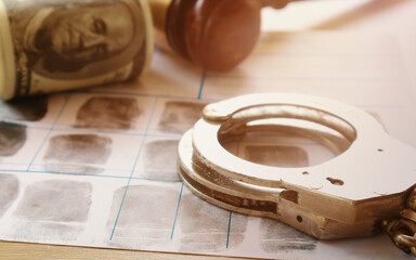 Crime and punishment concept.Punishments,such as fines and imprisonment, are intended to deter criminal behavior and protect society.severity of the punishment should match the severity of the crime