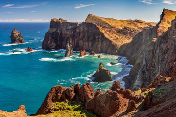 View from Ponta do Rosto on the Ponta de Sao Lourenco peninsular, a popular lookout offering views of the jagged coastline and offshore rock formations at the eastern tip of Madeira. - obrazy, fototapety, plakaty