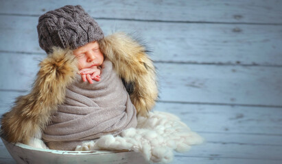 Younger brother. Newborn baby. Son. Newborn brother. Family. child in the family. 9 months. Baby. The large family. Son. Love. Gentle baby. Cute baby is sleeping. Baby in a knitted hat with fur
