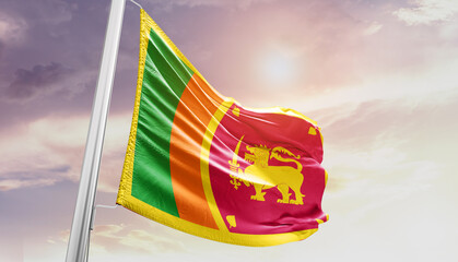 Waving Flag of Sri Lanka in Blue Sky. The symbol of the state on wavy cotton fabric.