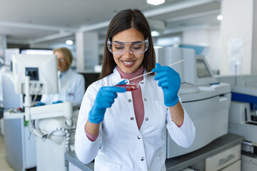 Scientist Works with Petri Dishes with Various Bacteria, Tissue and Blood Samples. Concept of...