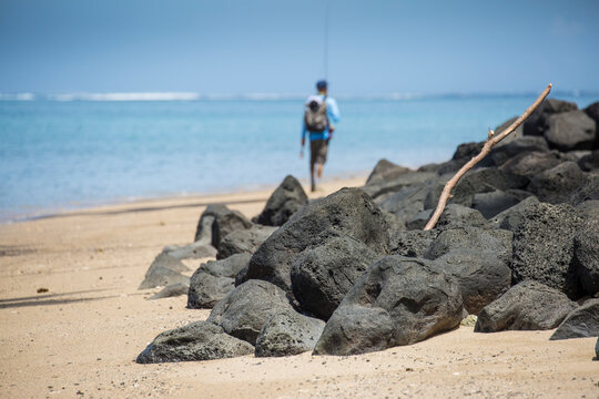 Angler Jonathan Jones hikes the beaches of Samoa in search of fly fishing waters.