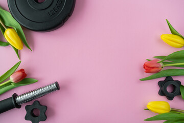 Gym dumbbell barbell weight plate and tulips flowers. Gift for Women's Day, Mother's Day, birthday,...