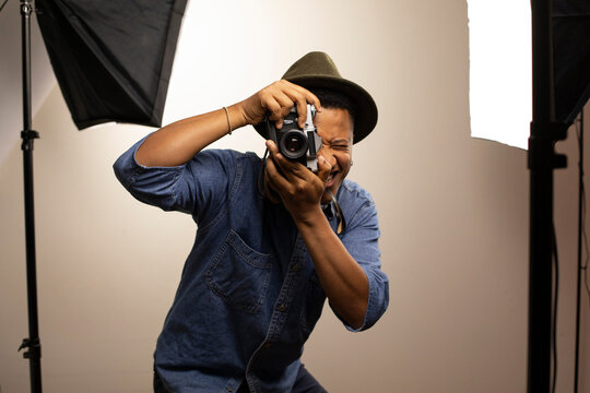 Photographer clicking photo in studio