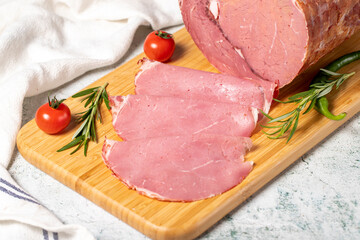 Sliced Smoked Beef Entrecote. Veal salami on wooden presentation board. Deli products. Meat products