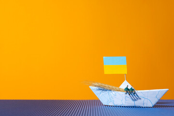 Concept of Ukrainian grain export with paper boat
