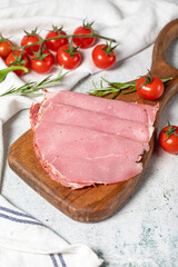 Beef salami on a wooden serving board. Dried smoked ribeye salami. close up