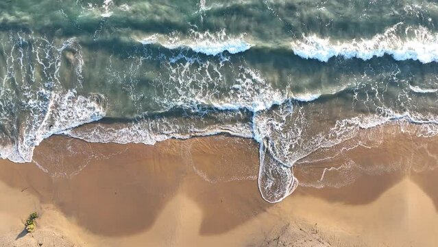 Pull Out shot of waves coming to shore