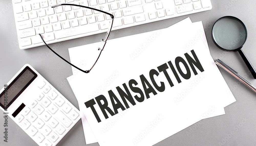 Poster transaction text on a paper with keyboard, calculator on grey background