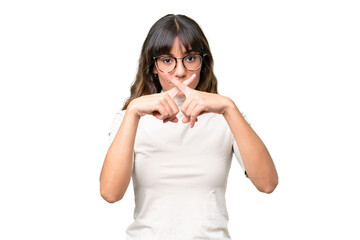 Young caucasian woman over isolated background showing a sign of silence gesture