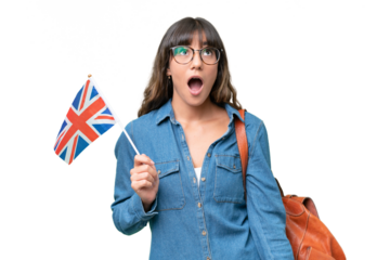 Young caucasian woman holding an United Kingdom flag over isolated background looking up and with surprised expression