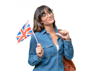 Young caucasian woman holding an United Kingdom flag over isolated background proud and self-satisfied