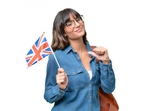 Young caucasian woman holding an United Kingdom flag over isolated background proud and self-satisfied