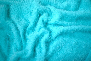 knitted fluffy blue background, blue faux fur texture