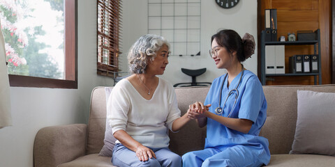 Home healthcare nurse, physical therapy with senior adult woman at home.