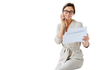 Attractive businesswoman reads papers or business documents, has telephone talk with business...