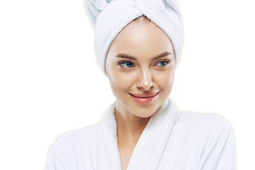 Day spa, beauty and freshness concept. Pensive European woman with healthy skin concentrated aside thoughtfully, feels refreshed after bath procedures, dressed in dressing gown, towel on head