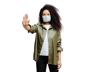 Horizontal shot of Afro American woman keeps palm towards camera, makes stop gesture, tries to prevent coronavirus or Covid-19, wears protective sterile mask, says no to world pandemic disease