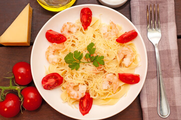 Pasta with shrimps, tomatoes and parmesan cheese