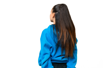 Young Arabian woman over isolated chroma key background in back position and looking back