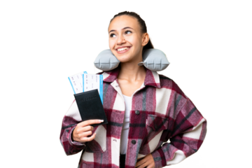 Young Traveler woman holding a passport over isolated chroma key background posing with arms at hip and smiling