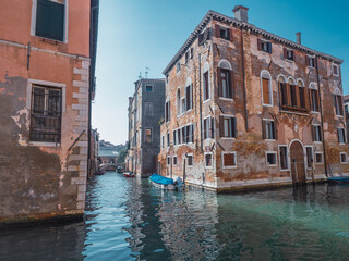 Fototapeta na wymiar Old buildings in the canals of Venice, in Italy.