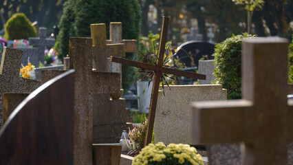 CEMETERY - Old steel crucifix and tombstones at burial site of the dead