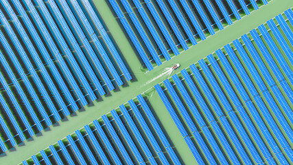	
Aerial photography of photovoltaic industrial park covered with solar panels	
