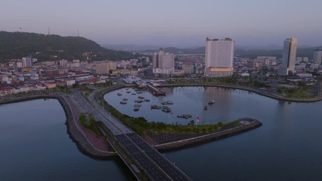 Drone cinematic shot of fish market mercado de marisco in Panama at sunrise with fisher boats and high tide 
