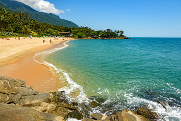 Blue sea of ​​Ilhabela and the shore, seen from above the rocks, São Paulo