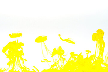 Abstract background picture with yellow ink dissolving in water	