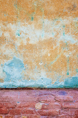 Venice Italy old, weathered, textured wall, background  in bright blue and yellow
