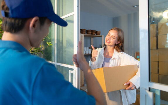 The delivery man brings the goods that the customer purchased and delivers them to the customer's home.