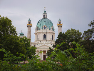 Catholic church located in the southern part of Karlsplatz, Vienna. One of the symbols of the city. The Karlskirche is a prime example of the original Austrian Baroque style. view across park