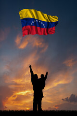 Father with son and the flag of Venezuela