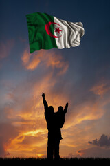 Father with son and the flag of Algeria