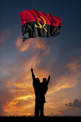 Father with son and the flag of Angola