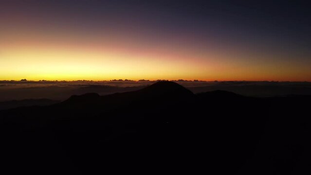 Aerial video of Mount Pulag at sunset with people in the background, the third highest mountain 