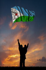 Father with son and the flag of Djibouti