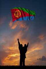 Father with son and the flag of Eritrea