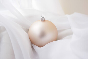 Pearlescent Christmas ball for the tree on a white background