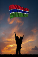 Father with son and the flag of Gambia